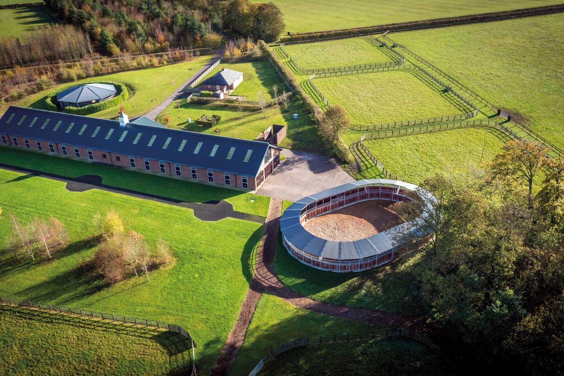 View of an equestrian centre from above with horse walker